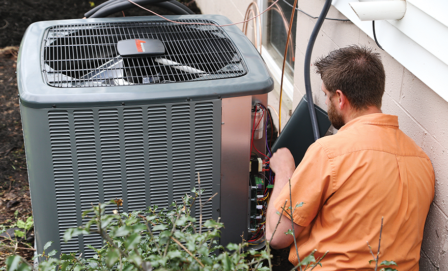 Residential Amana Repair technician working on wiring